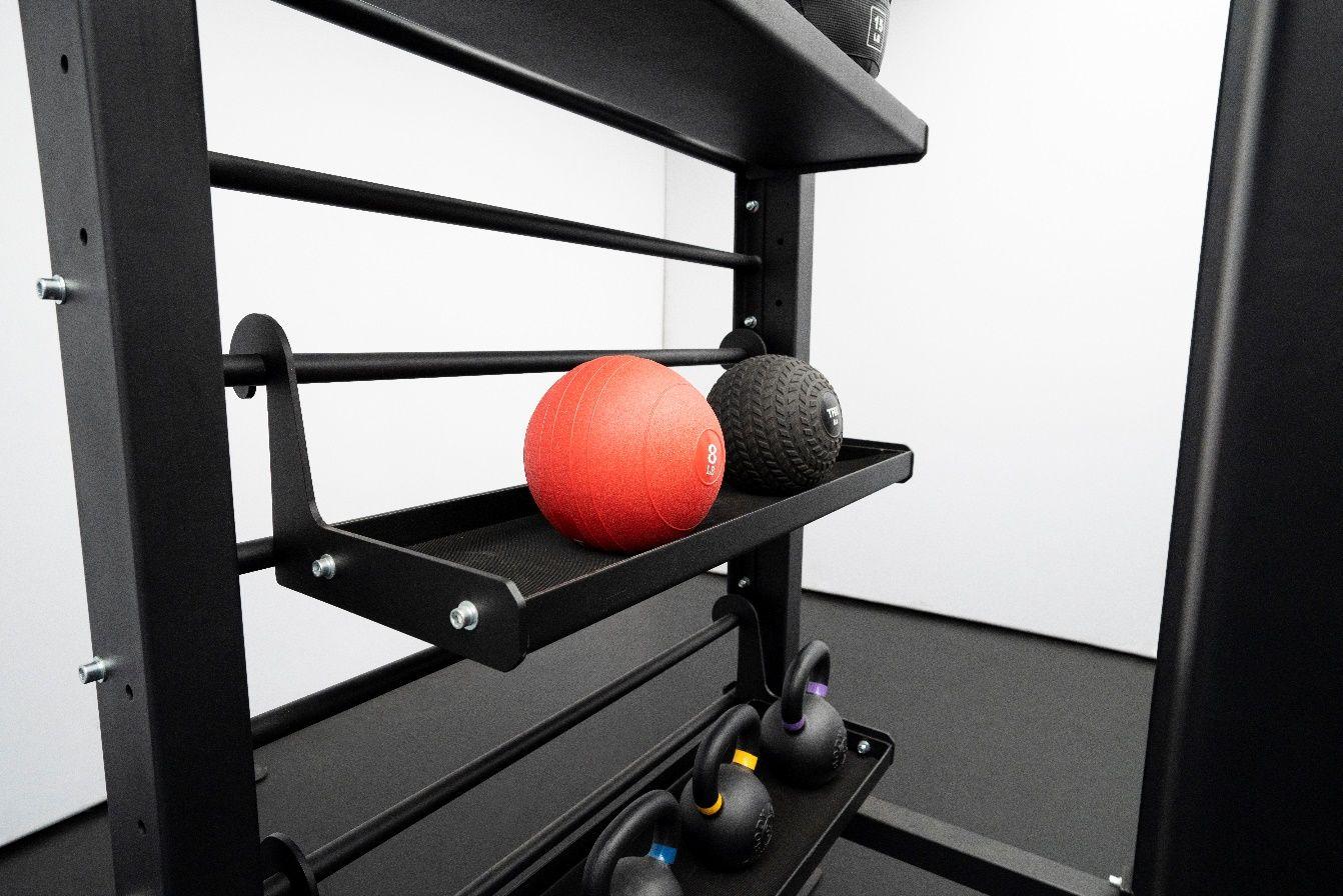 Storage shelves can fit accessories, dumbbells, weighted balls, kettlebells and an assortments of other items